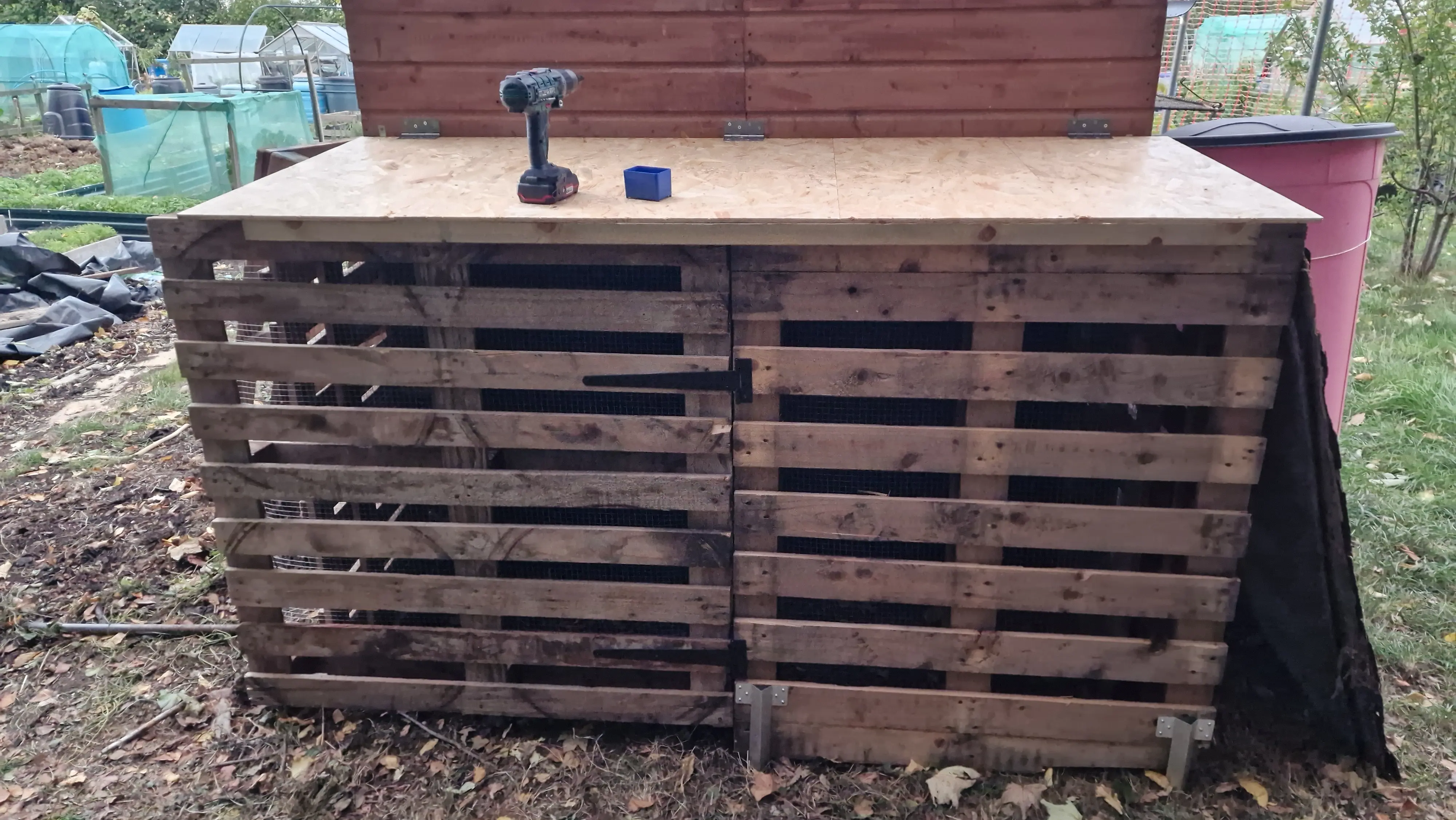 Front view of the pallet-built compost bin